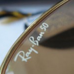 photo of NOS Ray-Ban 50th anniversary sunglasses 62mm. logo view sm