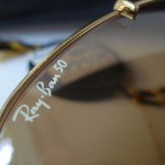photo of NOS Ray-Ban 50th anniversary sunglasses 62mm. logo view